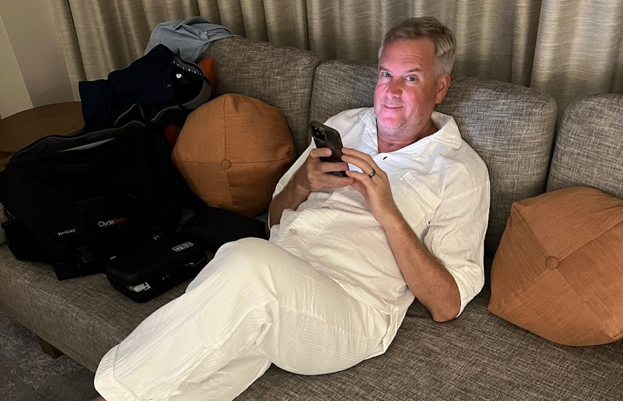 Man lounging in hotel room on couch in Japan