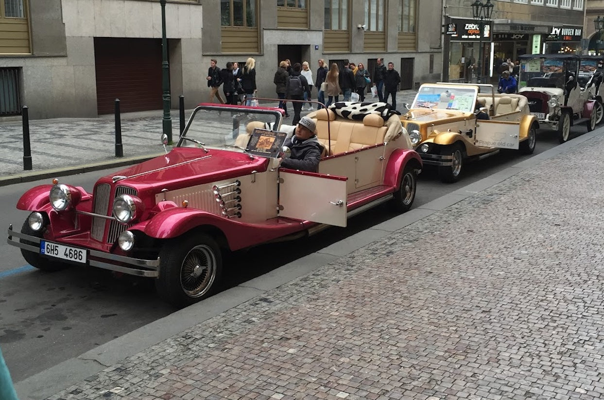 Vintage convertible cars lined up for tours in Prague, Czech Republic
