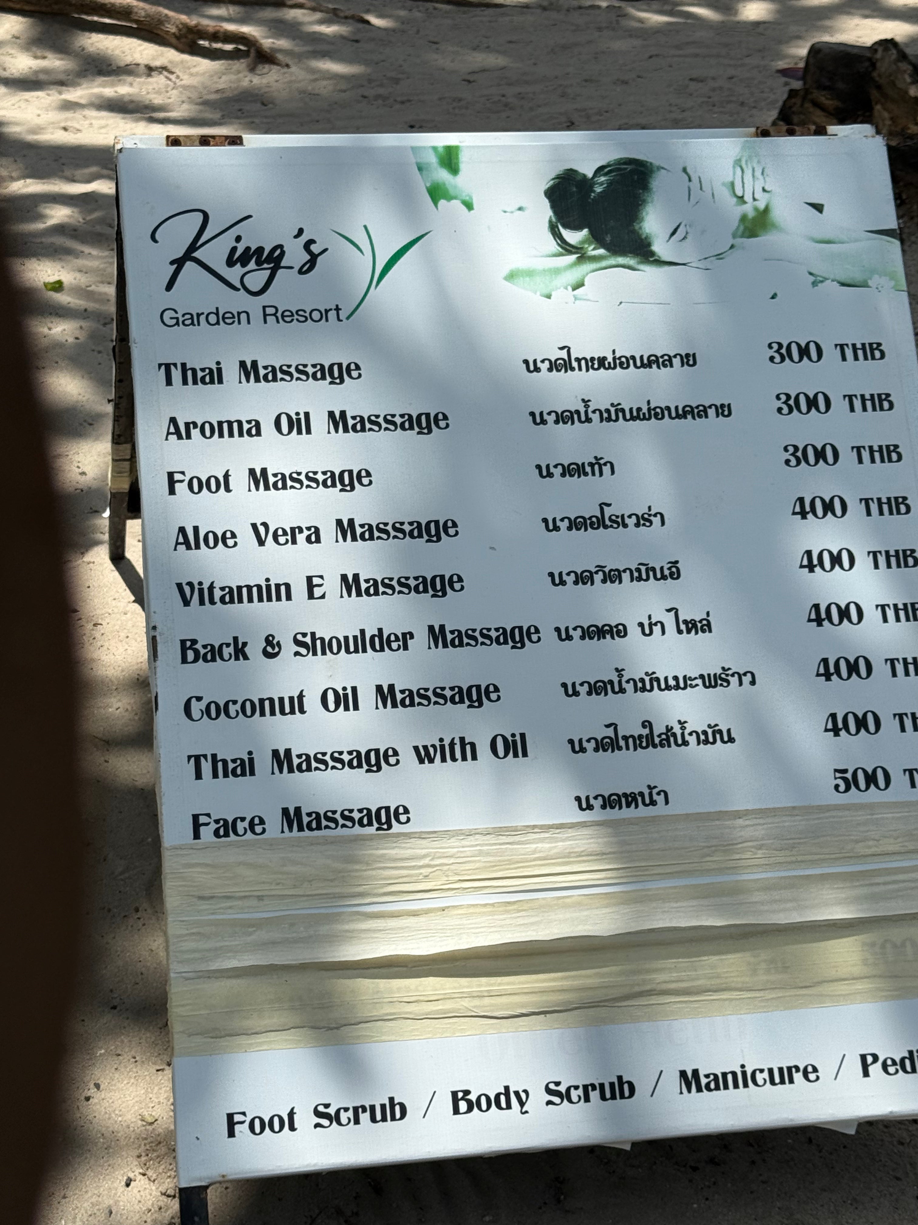 Menu board for King's Garden Resort with massage services and prices.