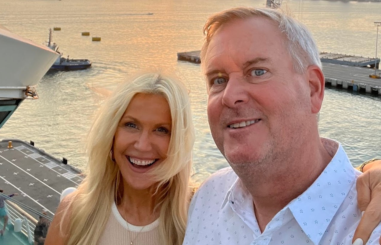 Couple smiling at sunset near cruise ship port in South America
